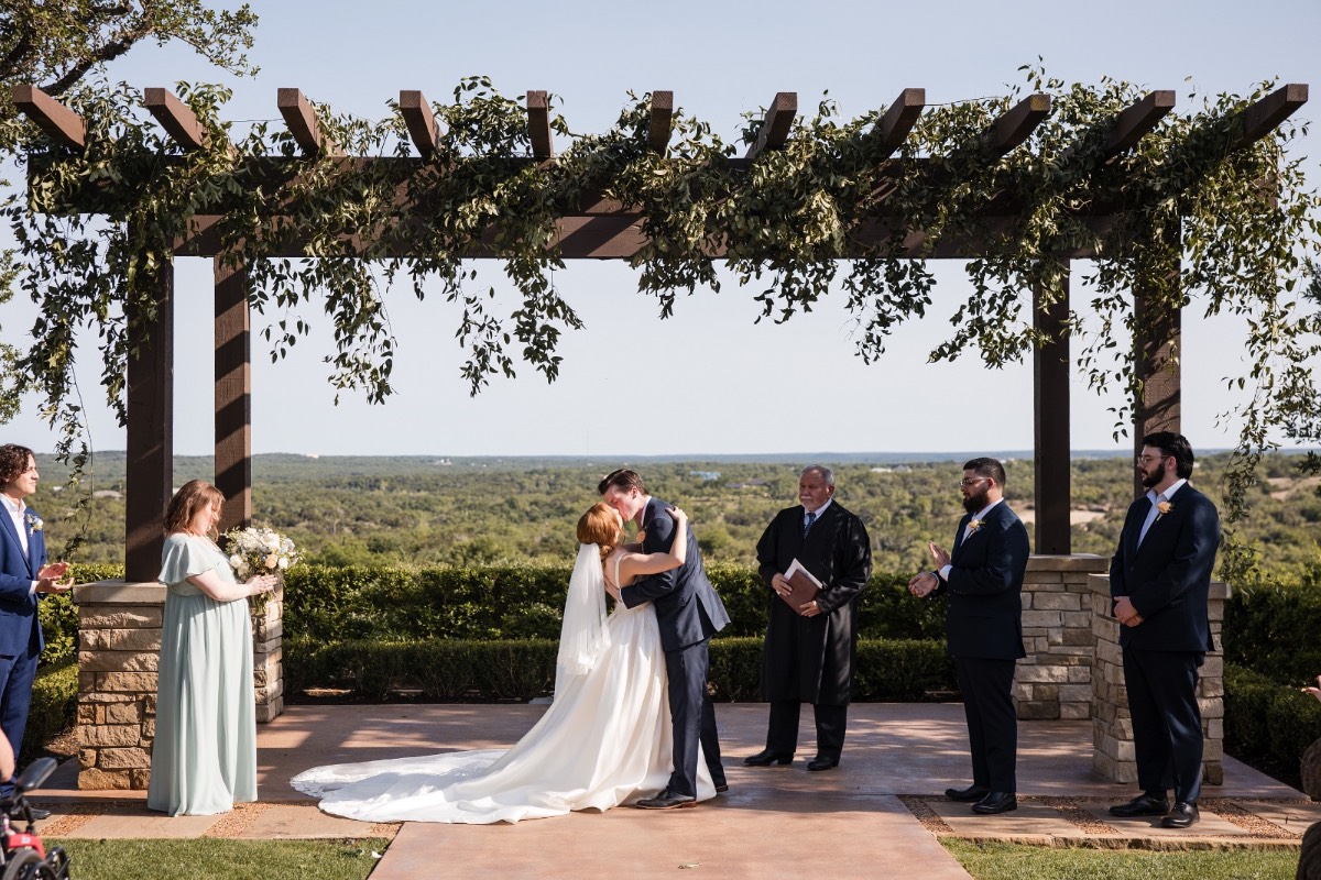 Bride O's processional at Canyonwood Ridge outdoor wedding in Dripping Springs