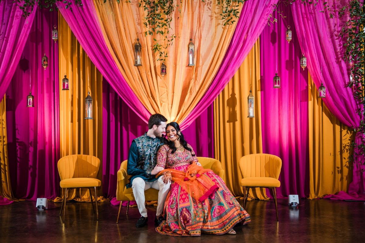 Hirva in bridal lehenga with groom Skylar at Texas venue