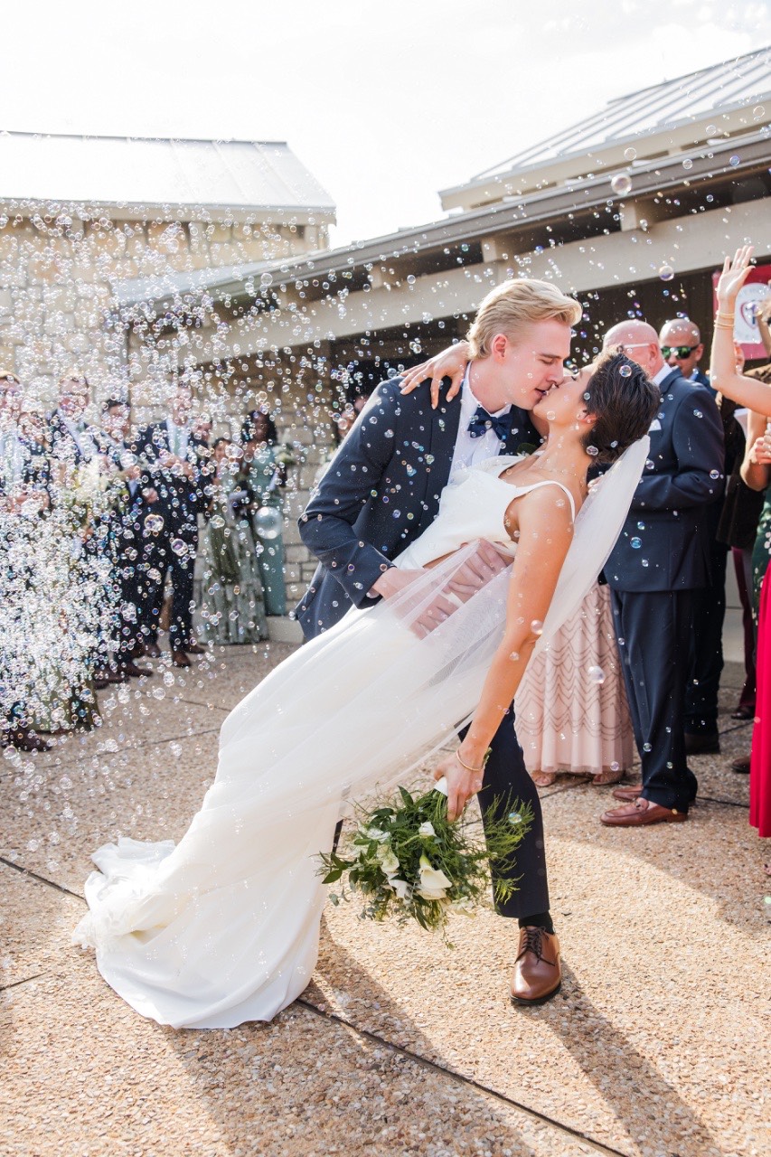 Officiant conducting K and N's wedding ceremony at Marble Falls venue