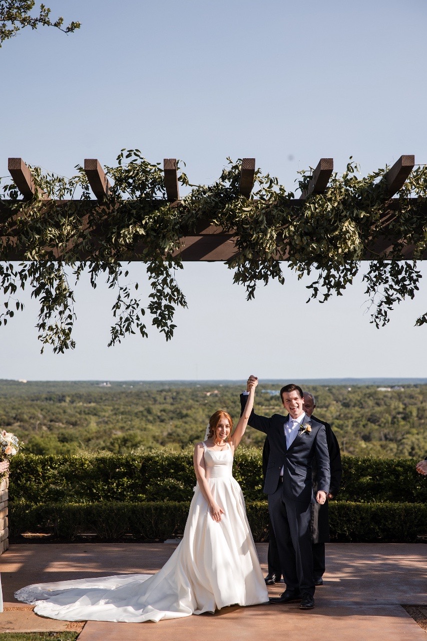 Groom C watches bride O walk down aisle at Canyonwood Ridge ceremony