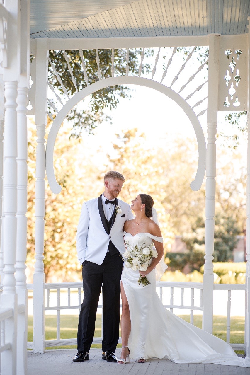 Bride and groom posing for The Bird and The Bear photographer after first look