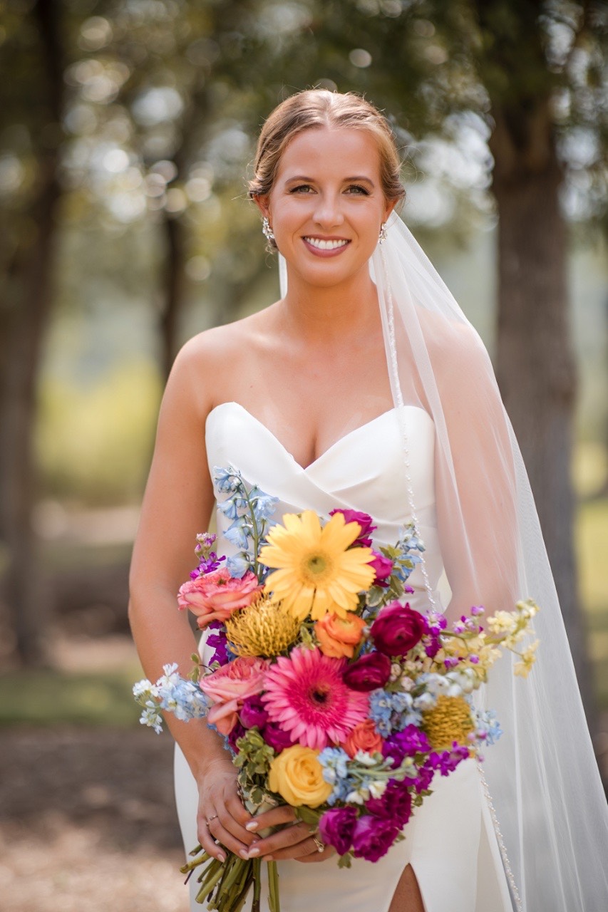 Officiant leading A and M's vows at their scenic Canyonwood Ridge wedding