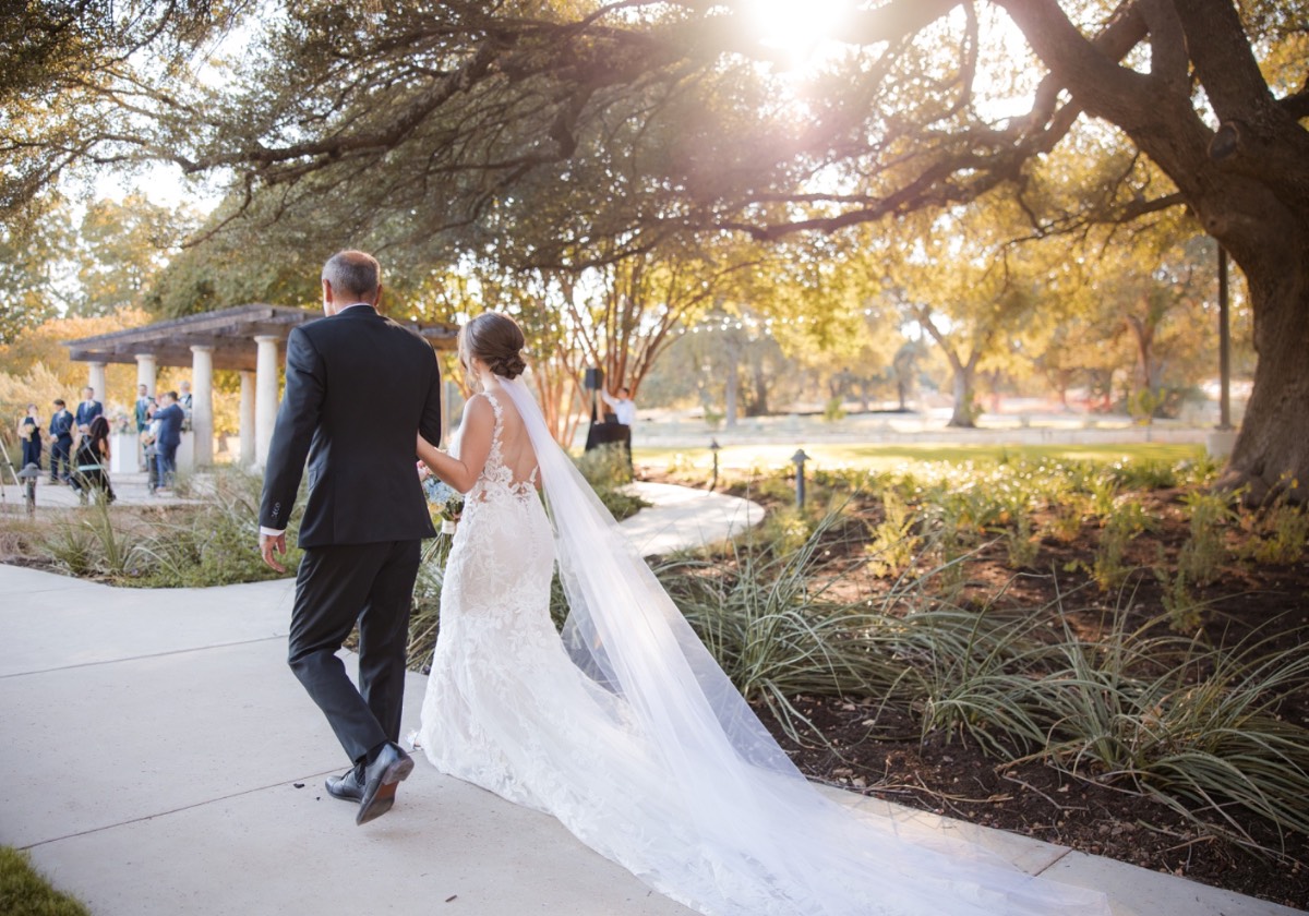 Bride and groom portraits outside Garey House Georgetown Texas venue