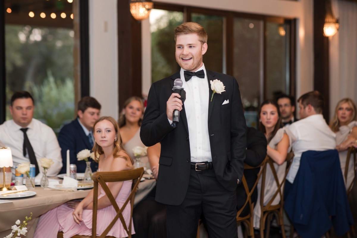 Newlyweds Darby and Will dancing during cocktail hour at ranch venue