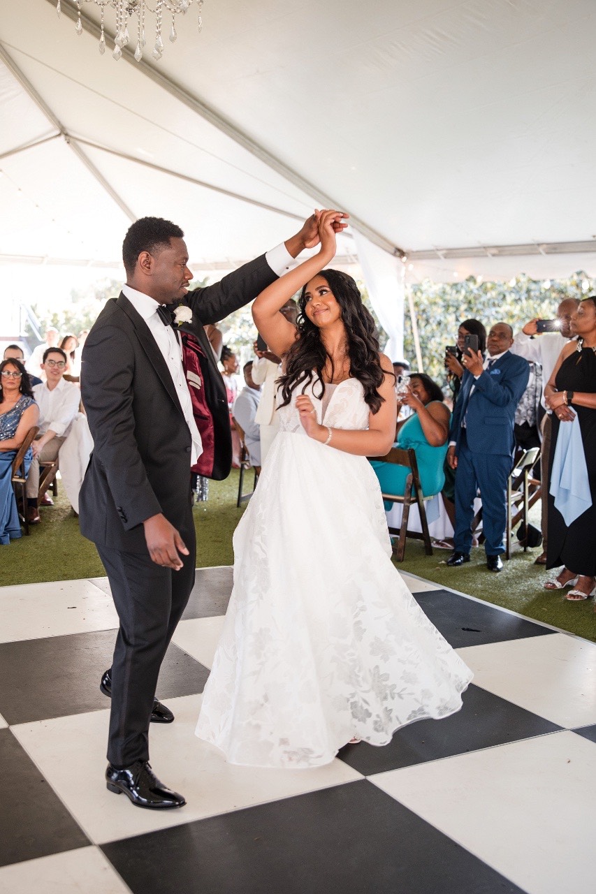 N walking down aisle at Woodbine Mansion Round Rock ceremony