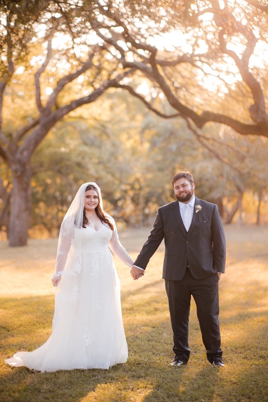 Golden hour portrait of bride S and groom D at Old Glory Ranch
