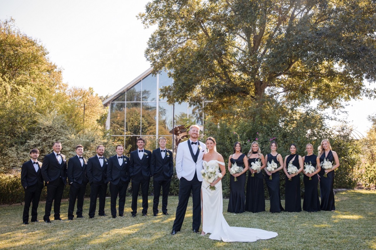 Ornate arch decorated with greenery and blooms for M and S Barr Mansion ceremony