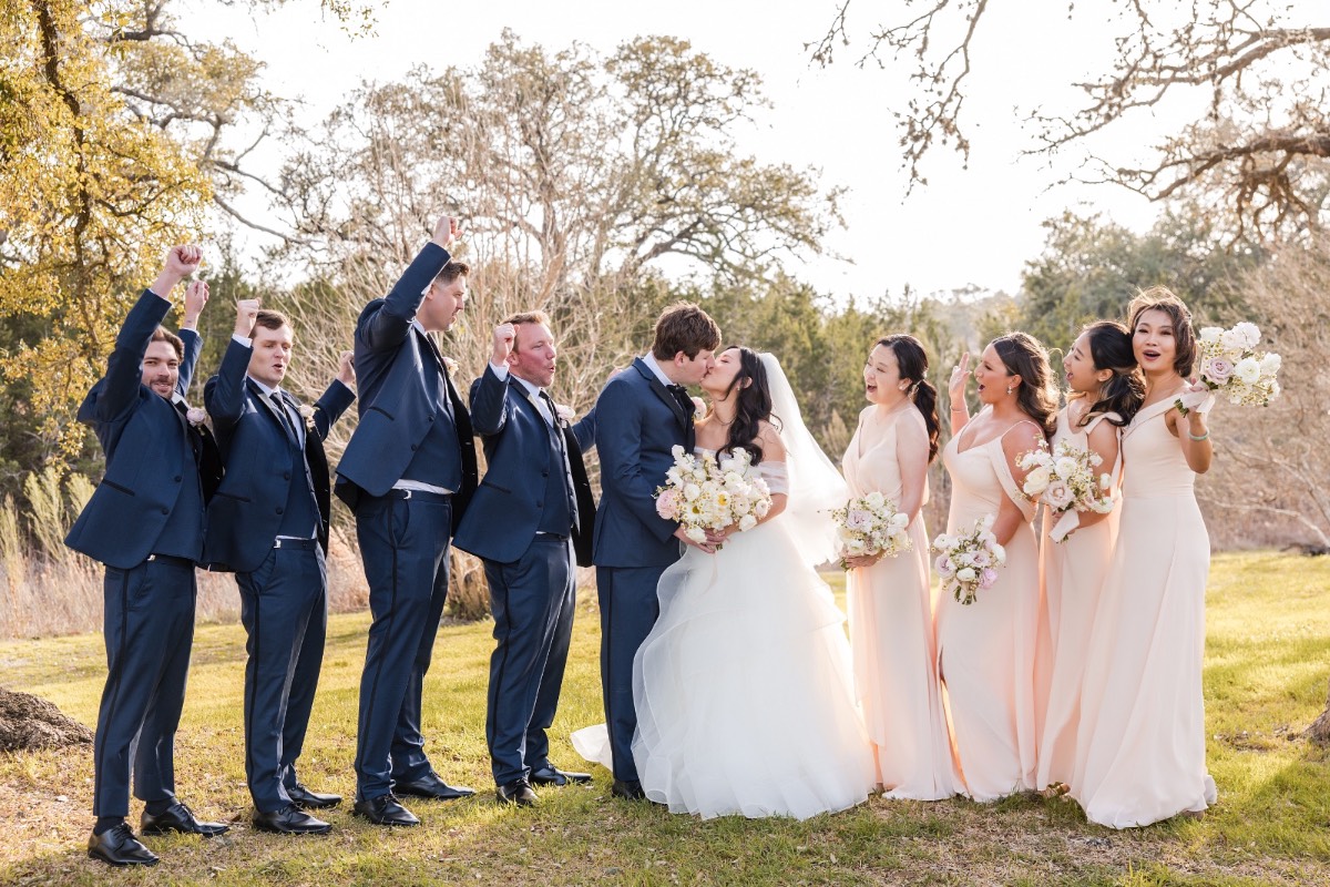 Bridesmaids with bride L in formal portrait at Pecan Springs Ranch Austin