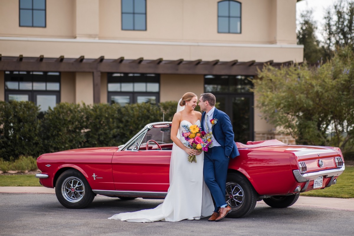 Guest perspective of A and M's outdoor Canyonwood Ridge wedding ceremony moment