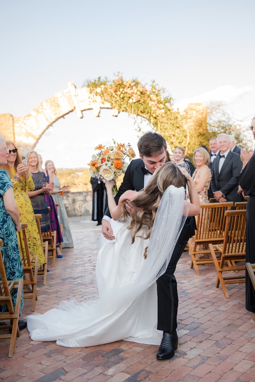 Couple entering cocktail hour reception area at Camp Lucy Dripping Springs