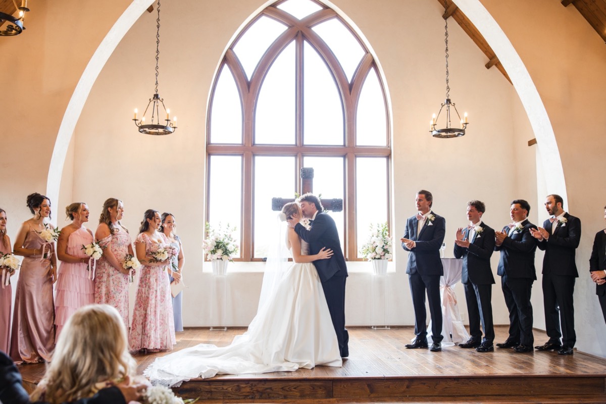 Golden hour portrait of groom with bride at Lampasas ranch