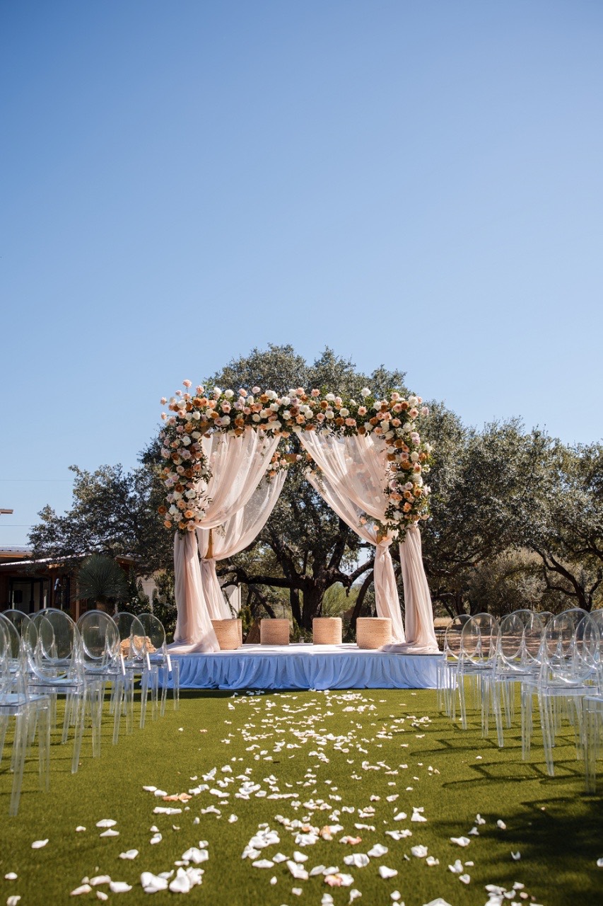 Ring exchange during Two Hearts One Stream wedding ceremony in Spicewood