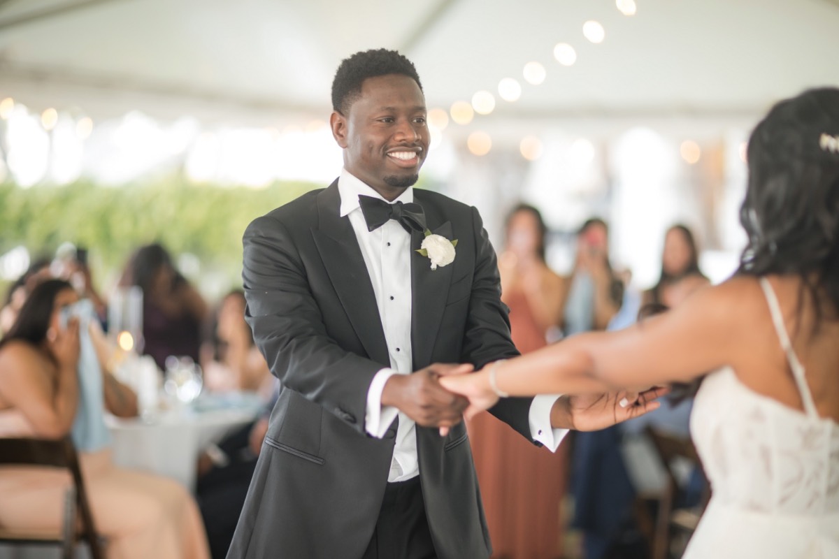 Bride N and groom H exchange vows at Round Rock venue