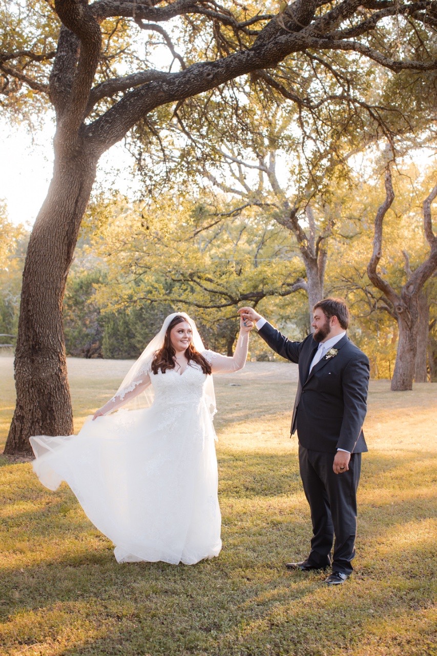 Romantic couple portrait with rustic ranch background at Old Glory Ranch Wimberley