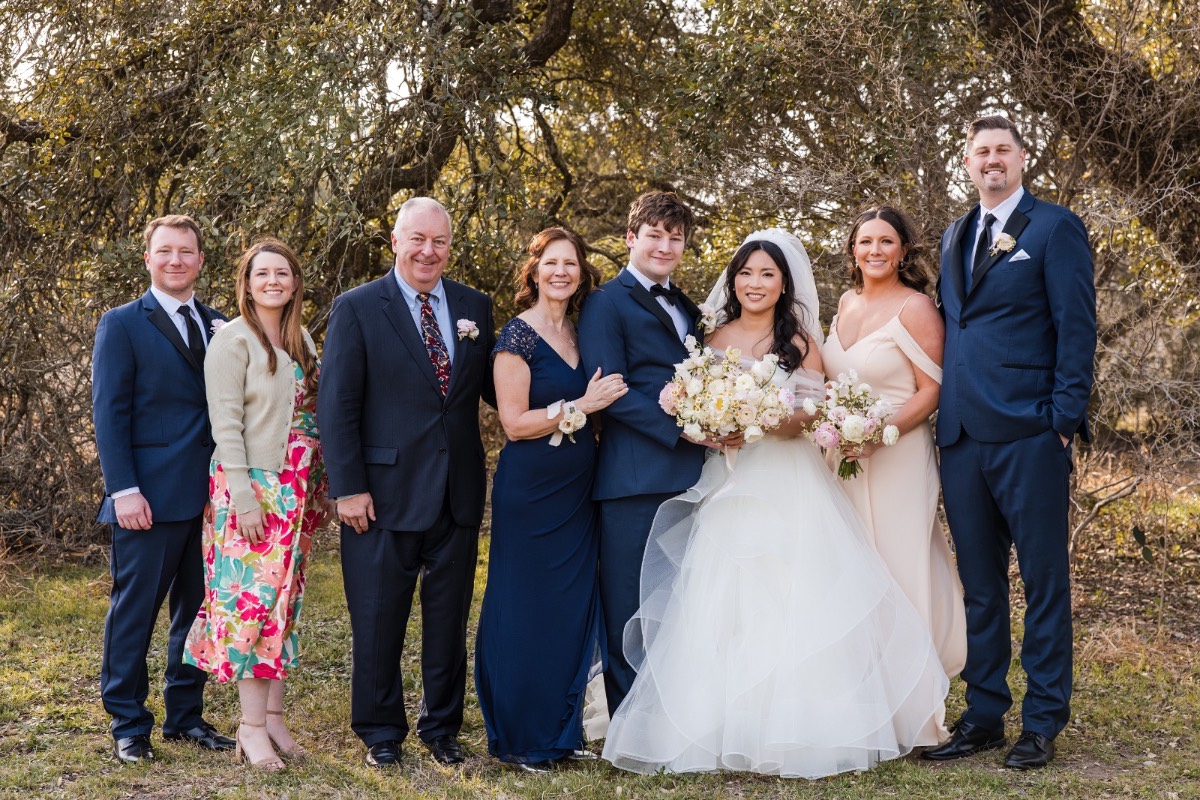 Matron of honor with bride L at Pecan Springs Ranch wedding photography