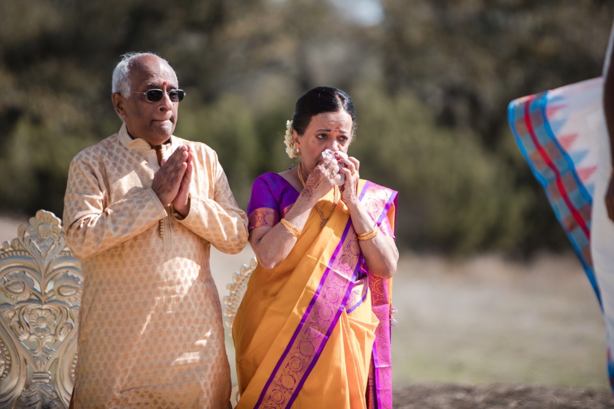 A's parents embrace during family photos at Prospect House Dripping Springs wedding
