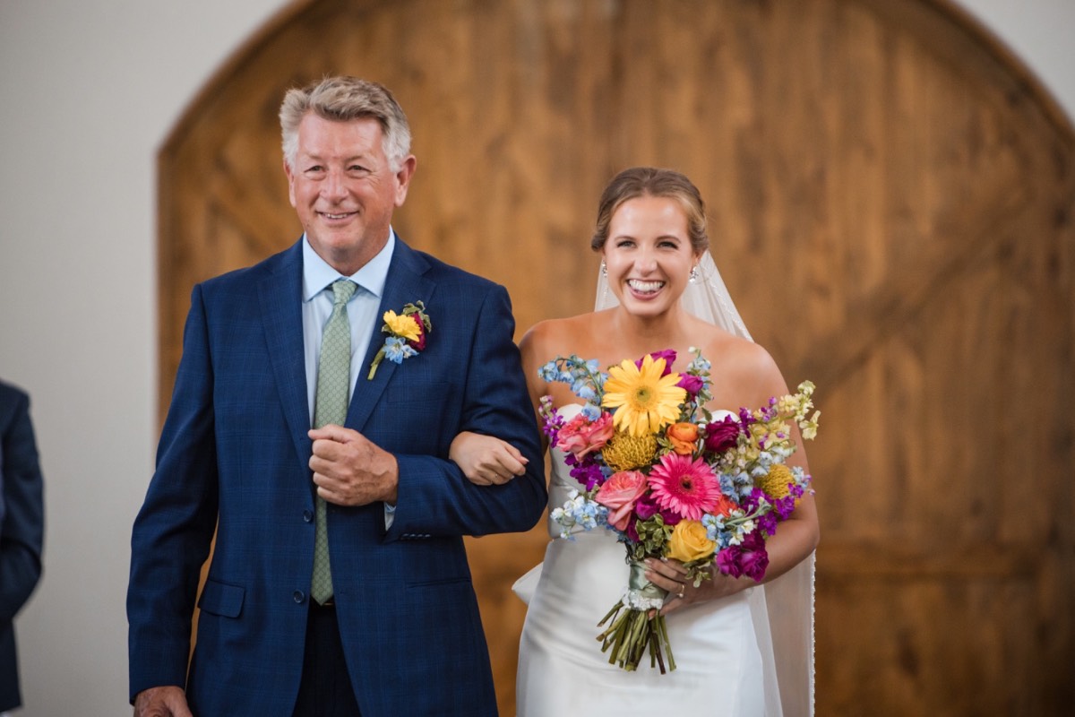 A and M's first kiss at their Canyonwood Ridge wedding photographed by The Bird and The Bear