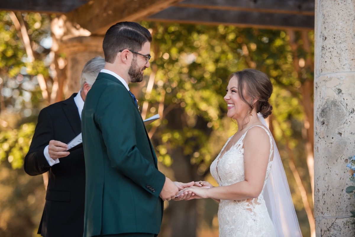 Bride and groom kissing in gardens at Garey House Georgetown