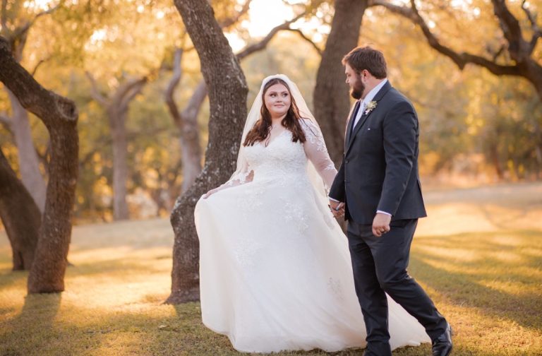 Bride S and groom D embracing during golden hour at Old Glory Ranch Texas