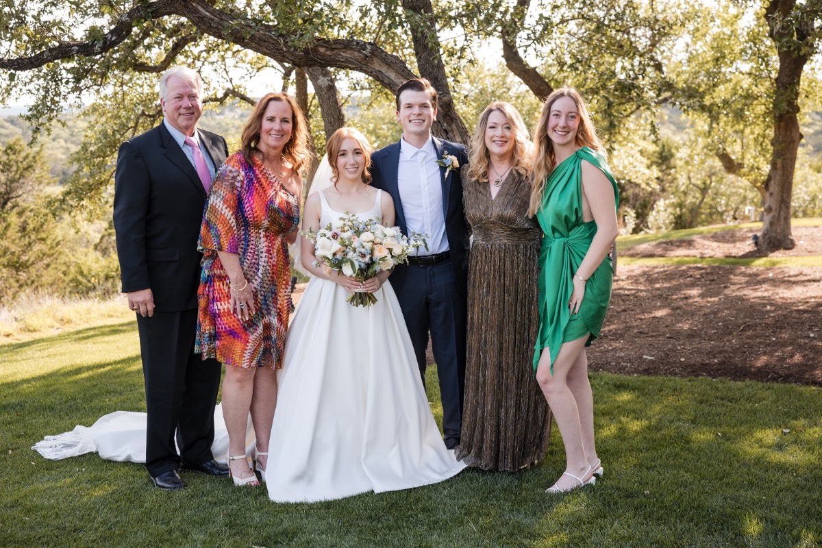 Newlyweds O and C celebrate after ceremony at Canyonwood Ridge in Texas