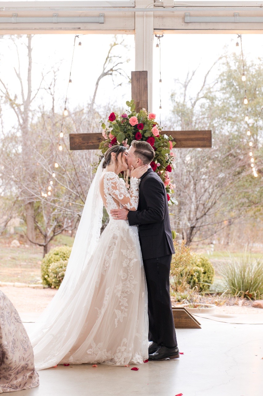 Emotional connection between couple captured before rainy wedding ceremony.