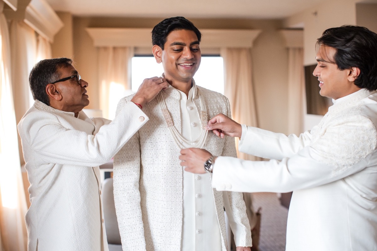 Wedding party posing with M and R after Renaissance Hotel Austin ceremony