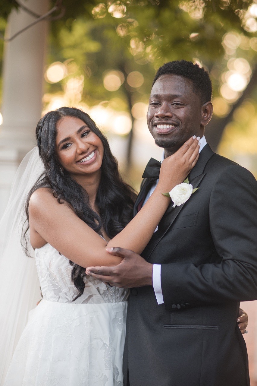 N and H holding hands during ceremony at Woodbine Mansion Round Rock