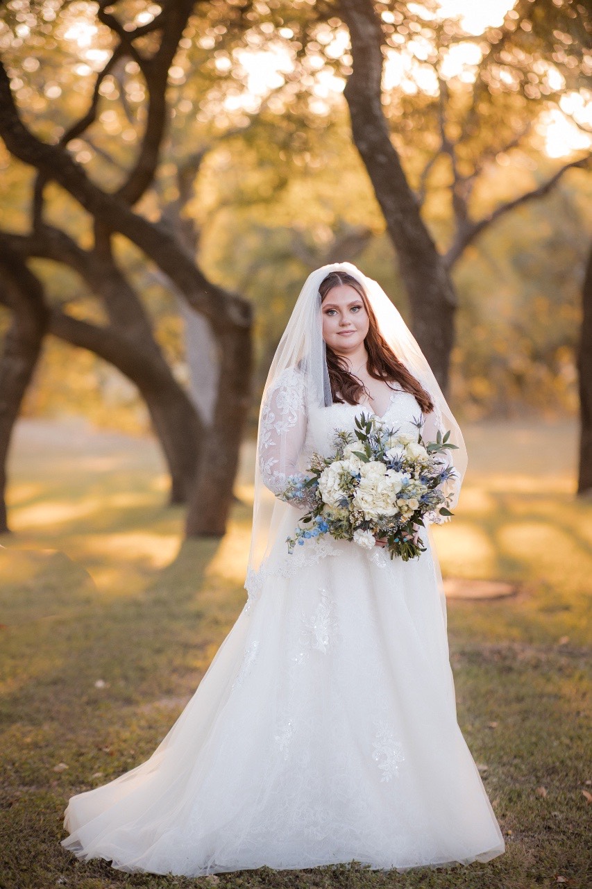Wedding photographer capturing couple portrait at Old Glory Ranch in Wimberley