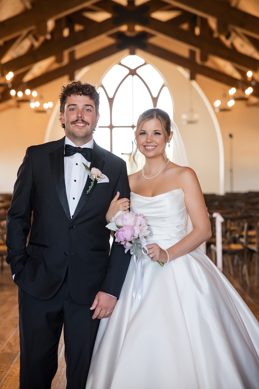 Groom dipping bride in romantic pose at Lampasas venue