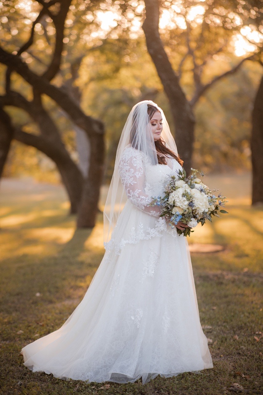 Bridal party group photo on lawn at Old Glory Ranch wedding venue Wimberley