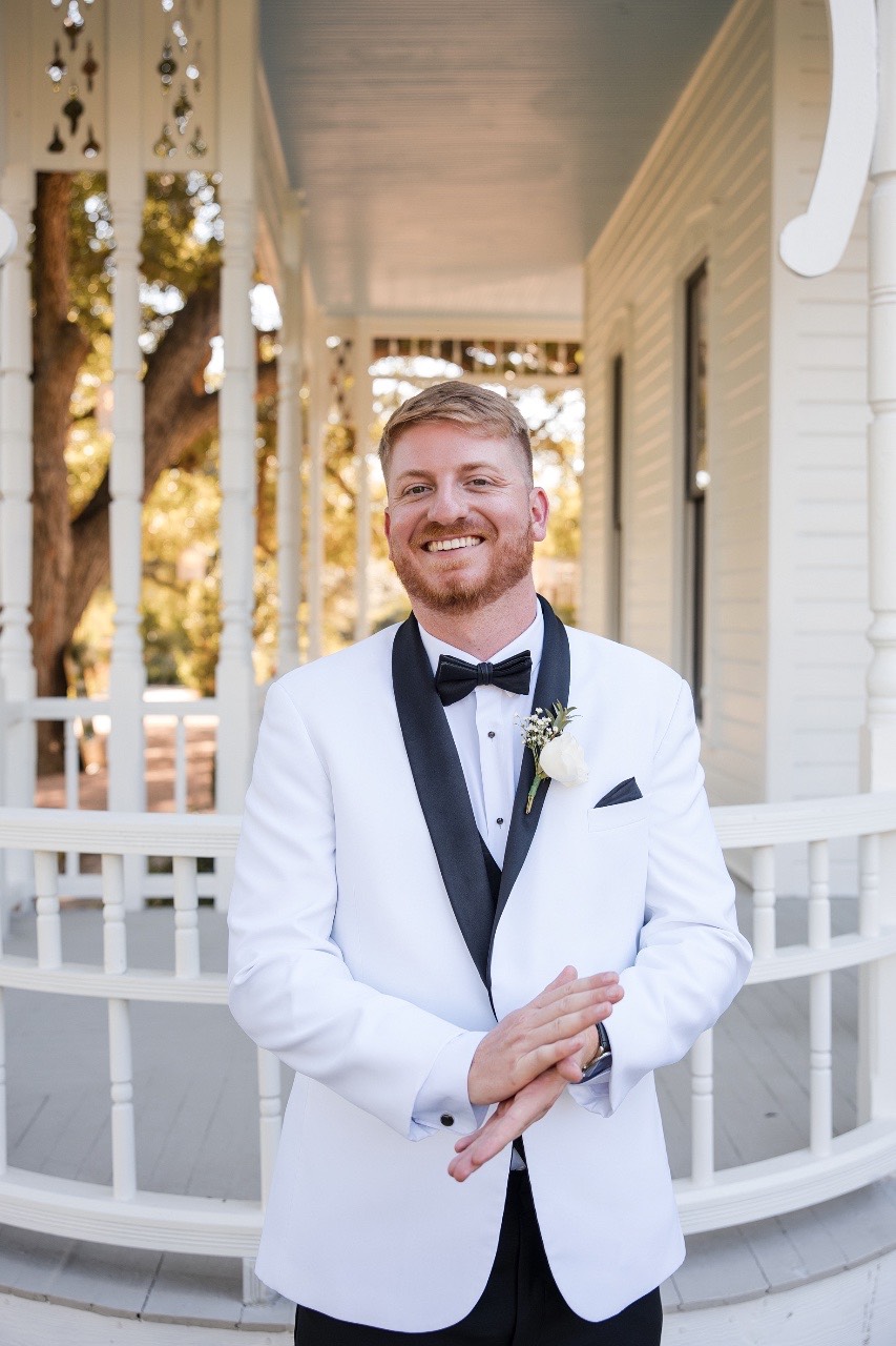 Groom waiting at altar for bride M at fall Barr Mansion wedding ceremony
