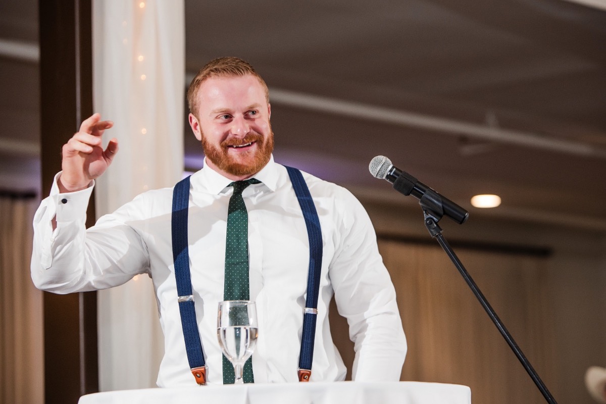 Groom and groomsmen laugh together during pre-ceremony photos at Highpointe Estate venue.