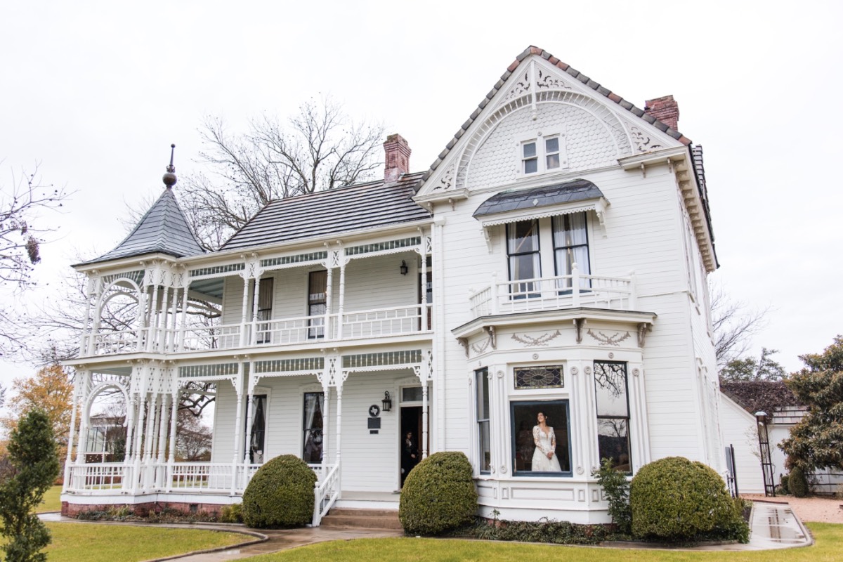 Groom's final preparations at Barr Mansion during rainy weather conditions.