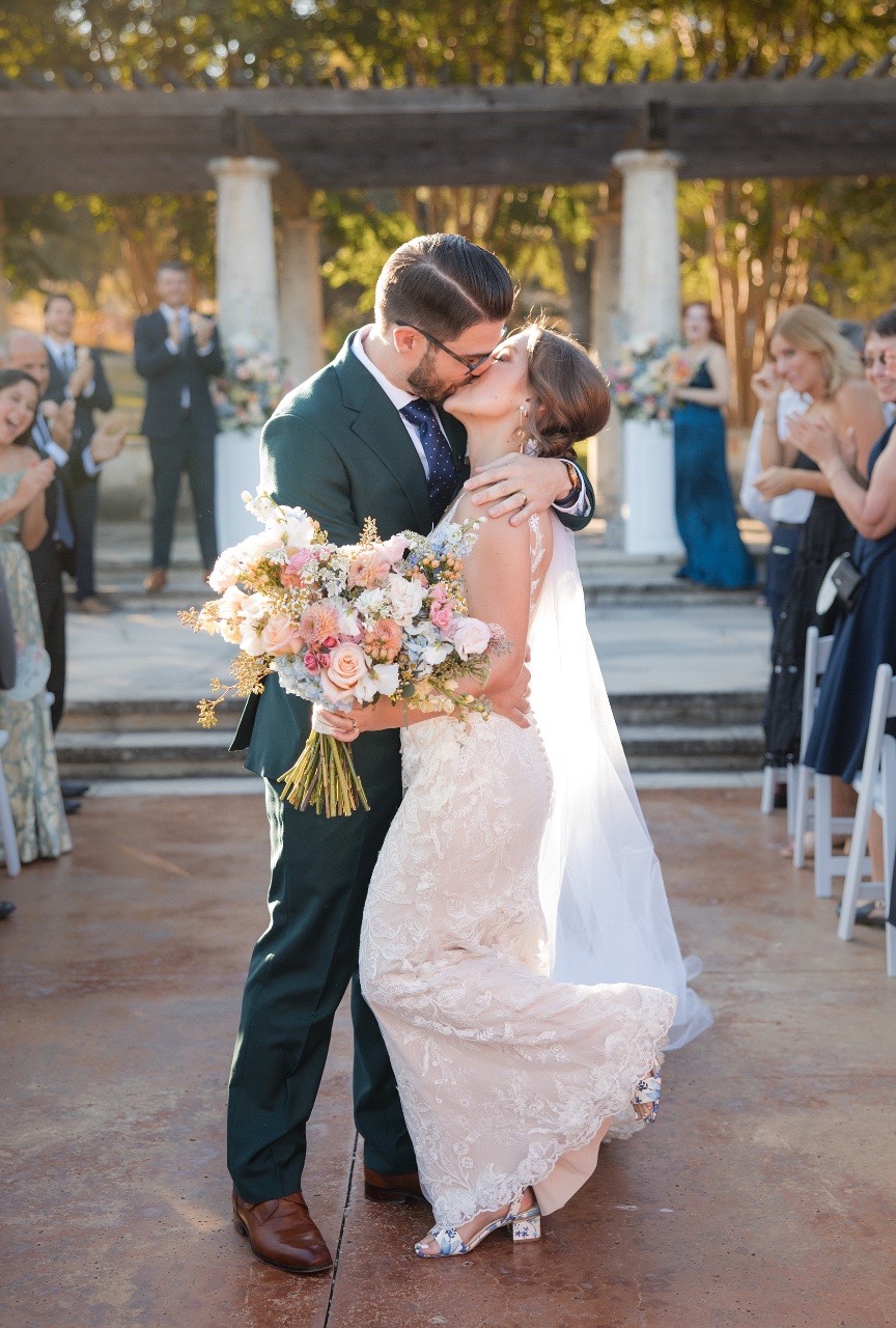 Bride and groom walking hand-in-hand at Garey House Georgetown