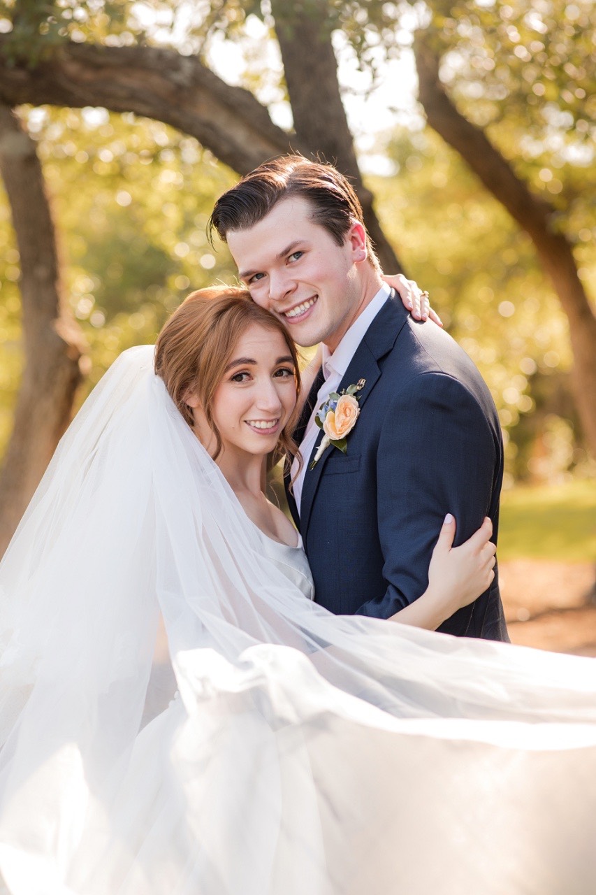 Close-up of bride's bouquet during O and C's Canyonwood Ridge ceremony