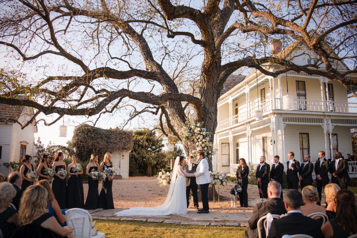 Bride processing down aisle at winter wedding inside Barr Mansion.
