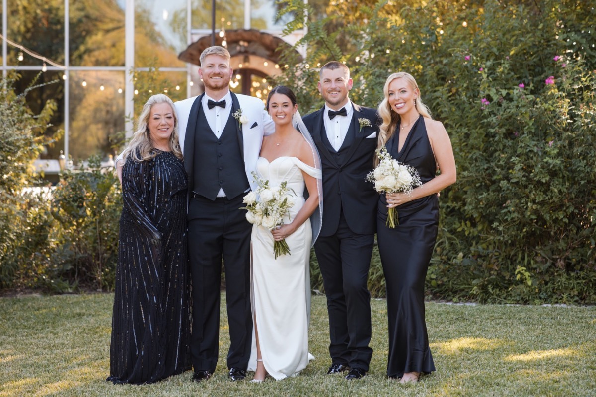 Bride and groom holding hands during ceremony at Barr Mansion wedding