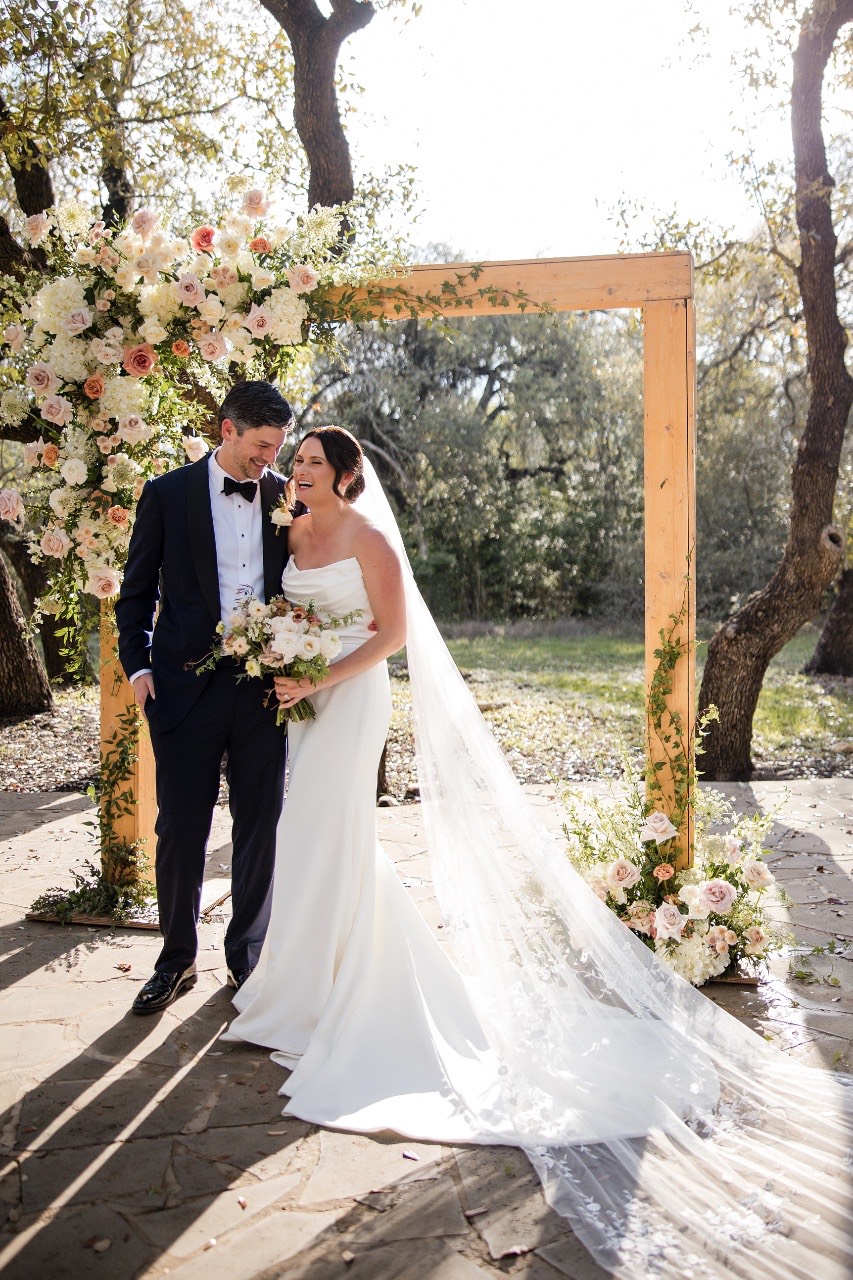 Couple's portrait with The Addison Grove's beautiful architecture in Austin background