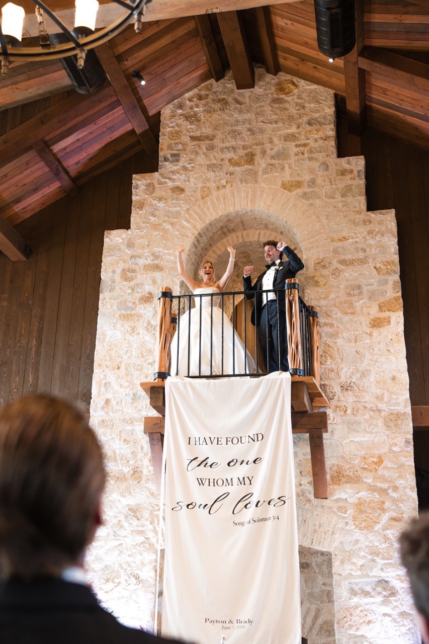 Videographer capturing couple's emotional reactions during Hidden River Ranch ceremony