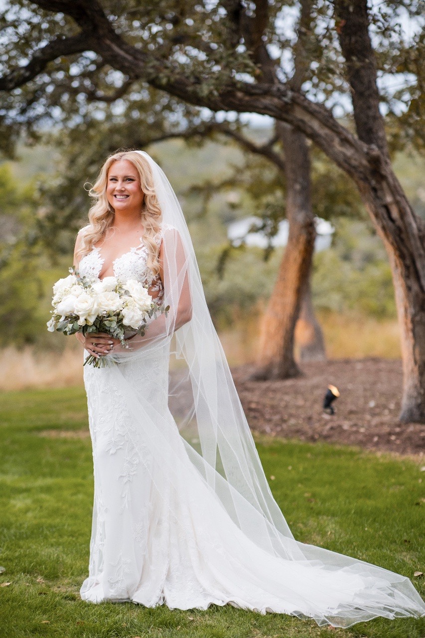 K and M holding hands during wedding ceremony at Canyonwood Ridge