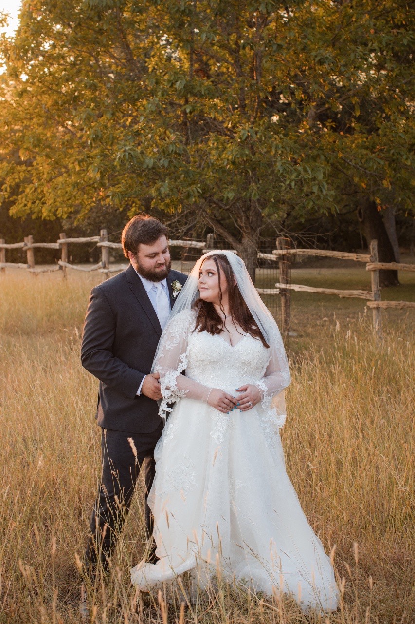 Parents posing with newlyweds at Old Glory Ranch wedding in Wimberley Texas