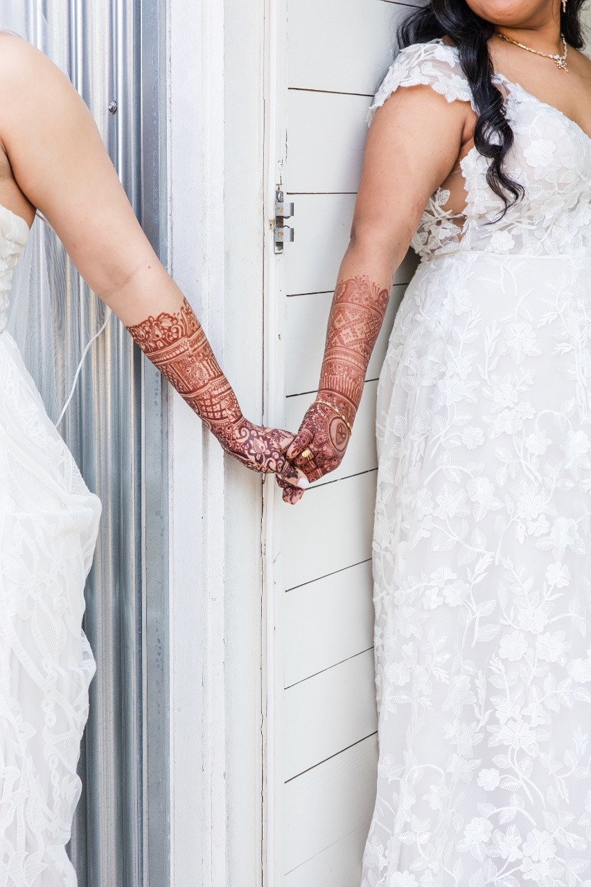 Bride and groom hand-in-hand portrait at Prospect House Texas wedding