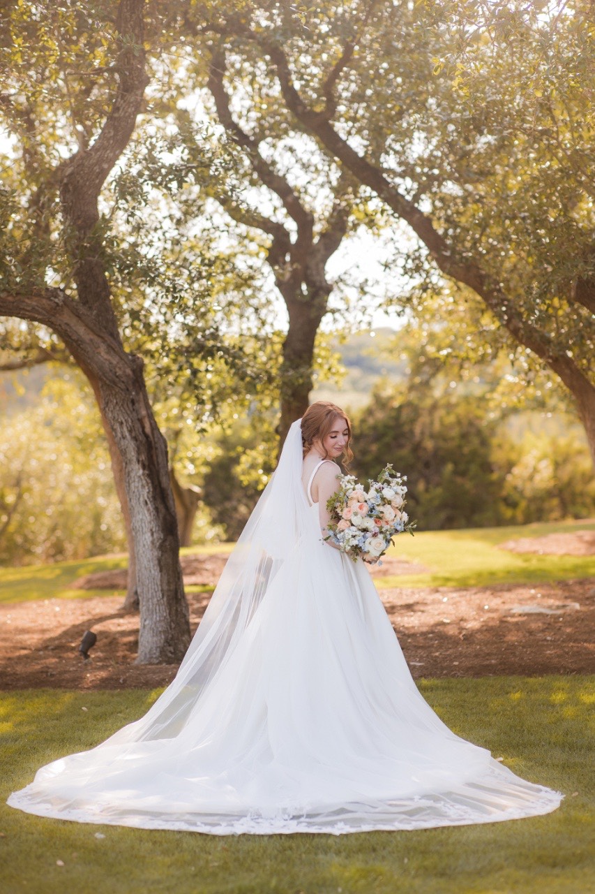 Bride and groom couple portrait at scenic Canyonwood Ridge outdoor wedding venue