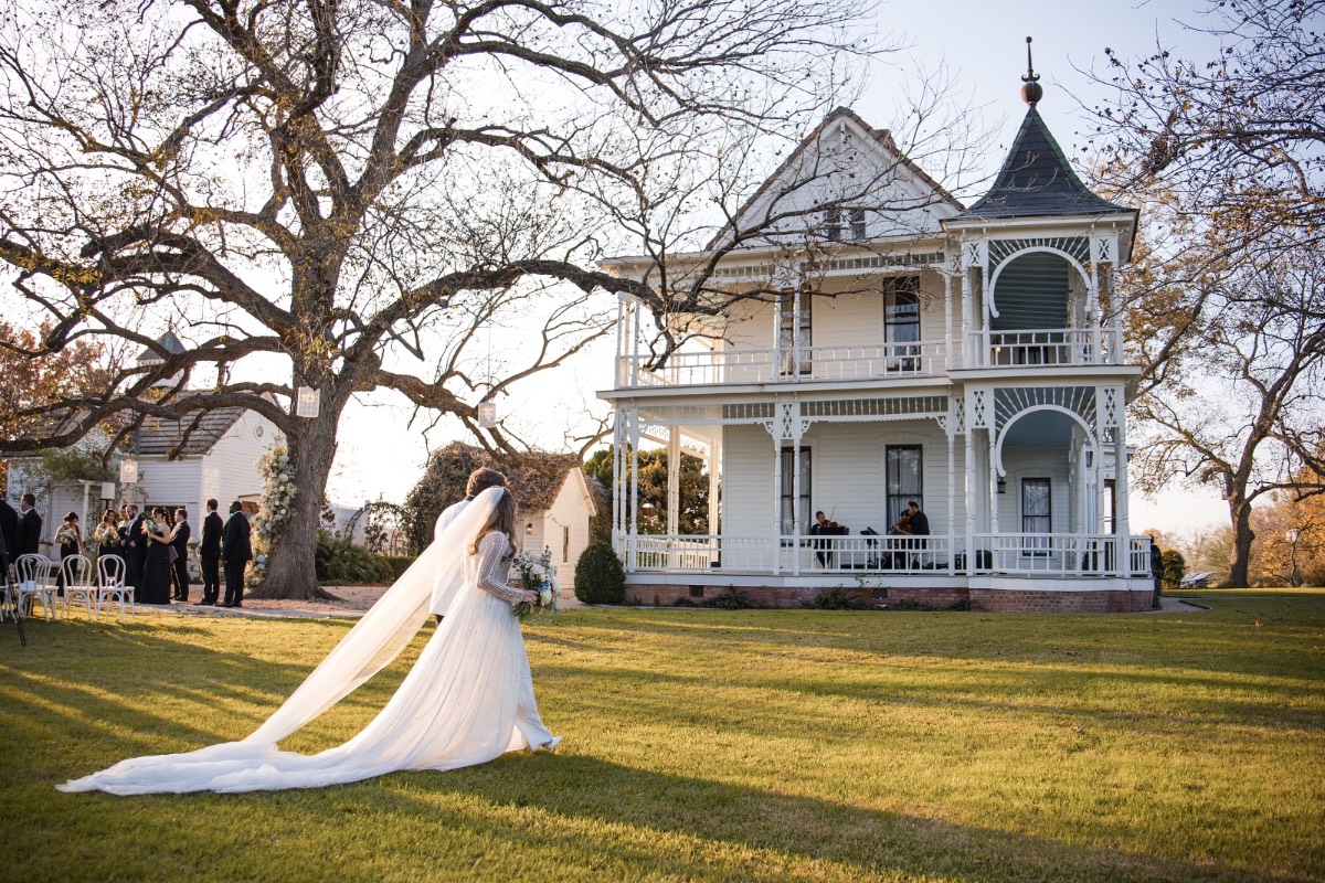 First kiss as married couple at Barr Mansion winter wedding Austin.