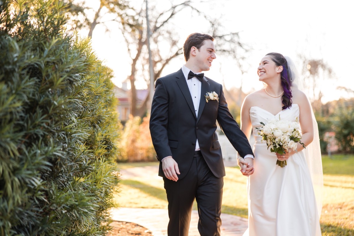 Groom dipping bride for classic wedding photo at Woodbine Mansion