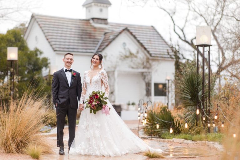 Wedding ceremony under covered area at Barr Mansion during rain.