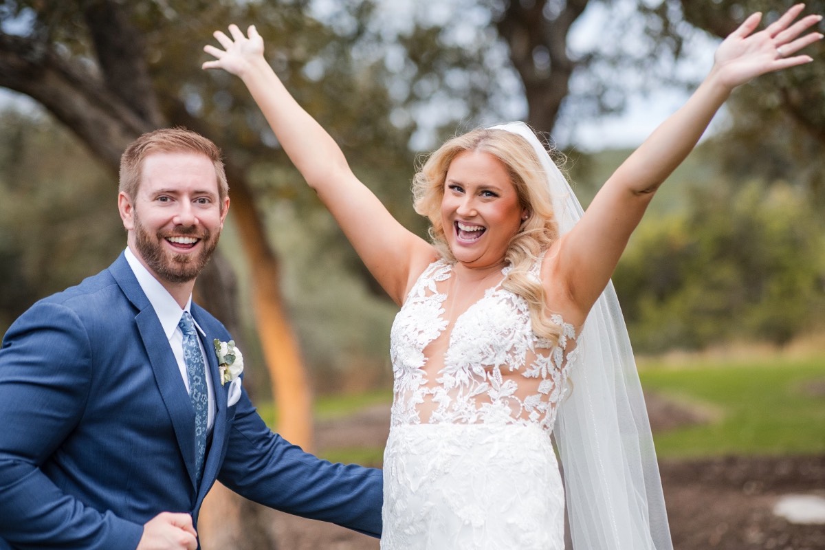 Bride and groom kissing as married couple at Canyonwood Ridge wedding