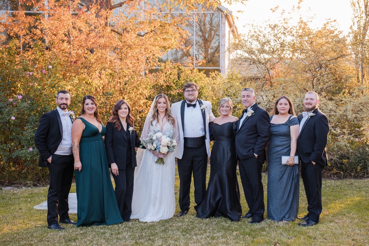 Bride and groom turning to guests after Barr Mansion ceremony kiss.