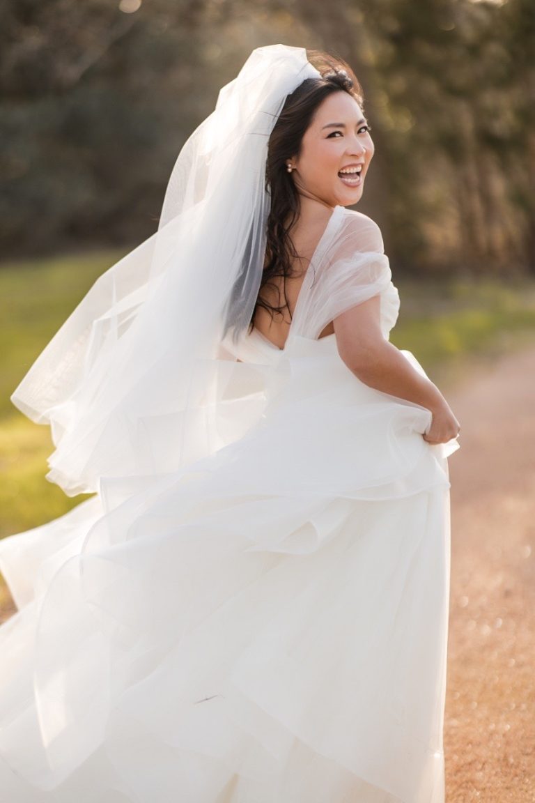 L in wedding dress with M in formal attire at Pecan Springs