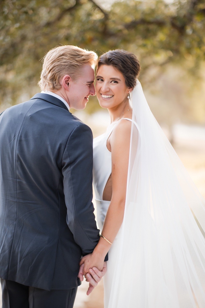 Bride and groom's romantic portrait at The Retreat at Balcones Springs in Marble Falls